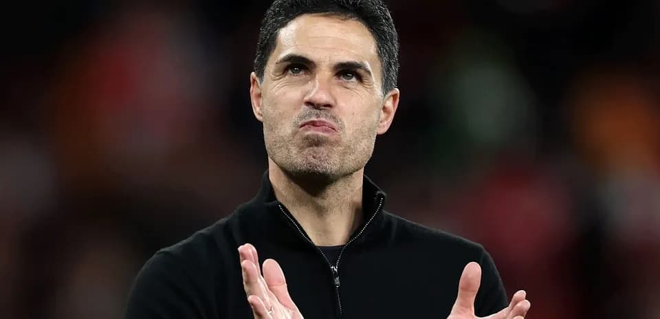 Manager applauding the crowd after a match