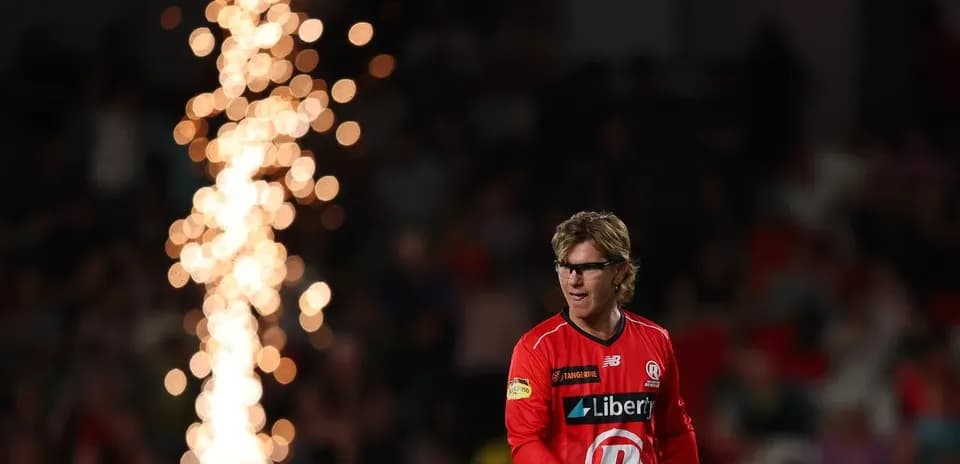 Player walking onto the field with pyrotechnics