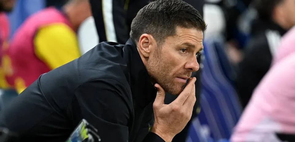 Coach observing from the sidelines during match
