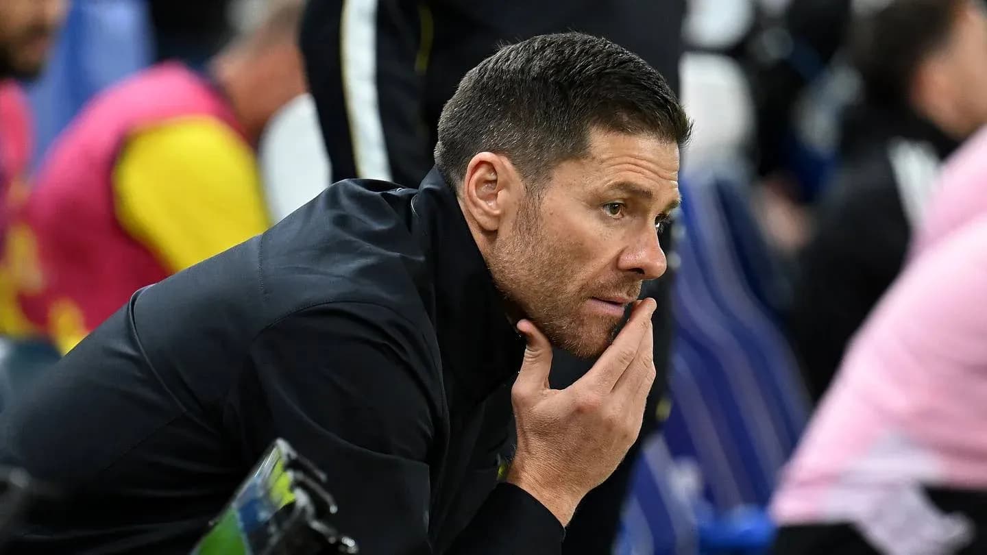 Coach observing from the sidelines during match