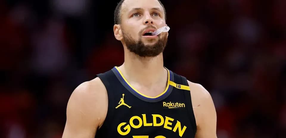 Player wearing Golden State jersey looking up