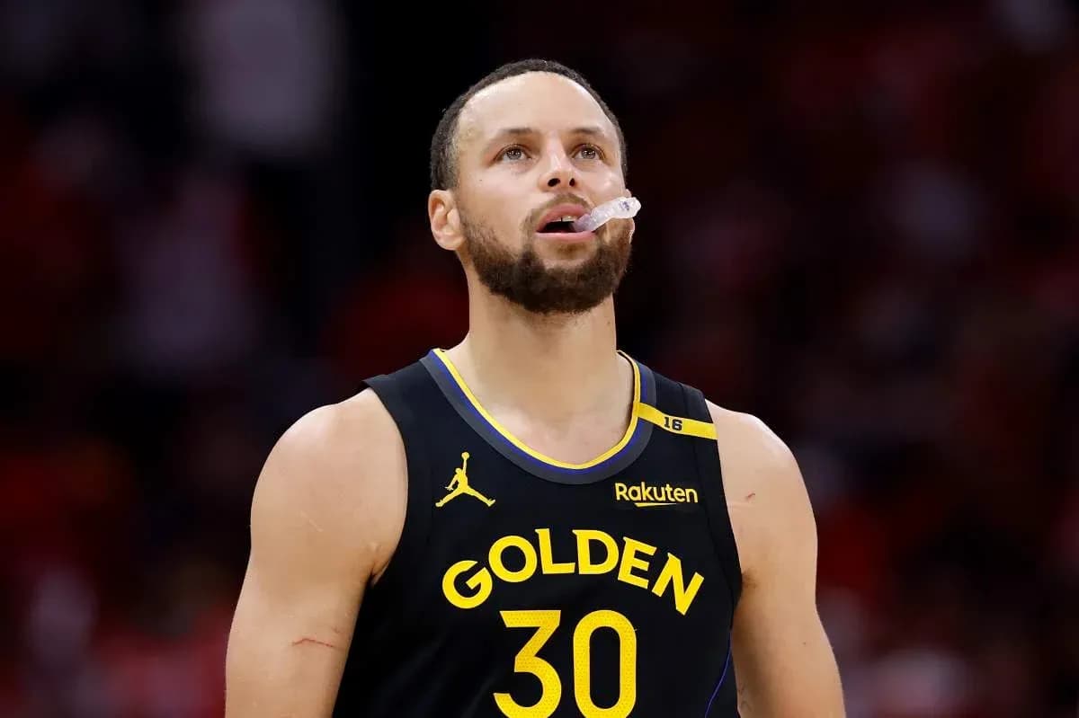 Player wearing Golden State jersey looking up