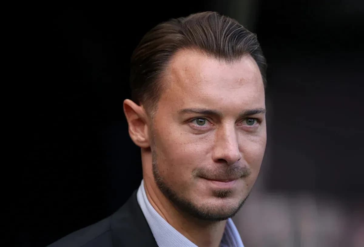Close-up of a man in a suit outdoors