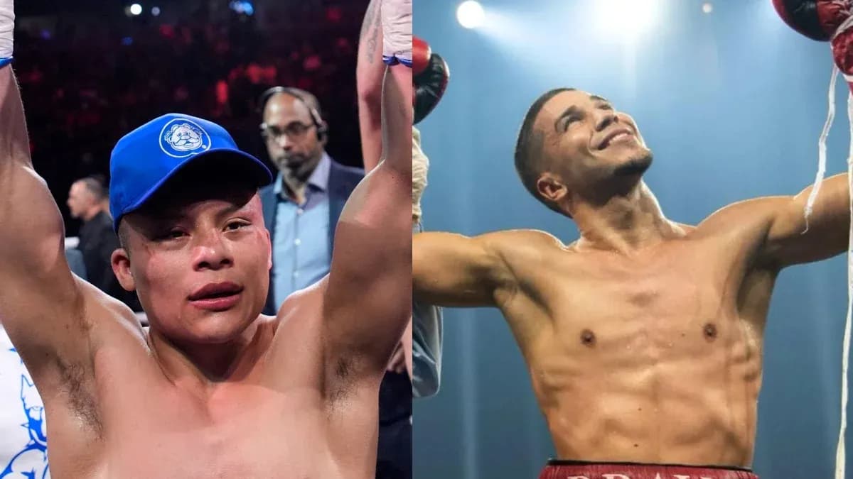 Two boxers celebrating victory in the ring