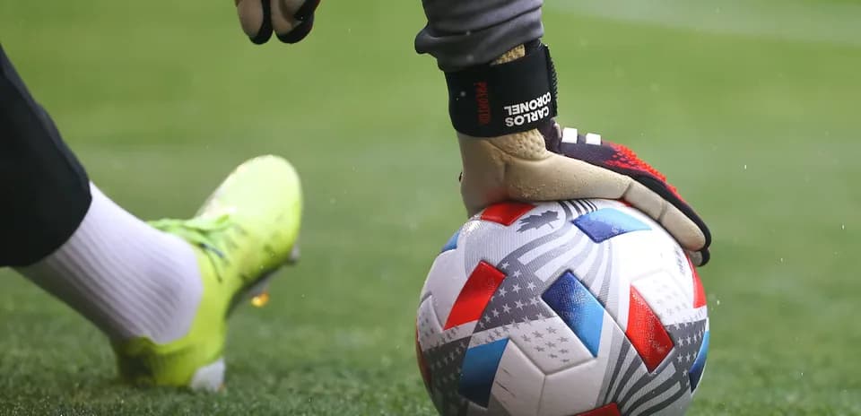 Goalkeeper preparing to kick the soccer ball