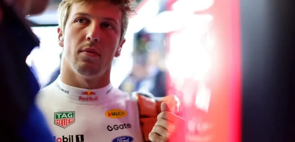 Driver preparing in garage before race event