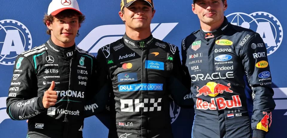 Three Formula 1 drivers posing together at event
