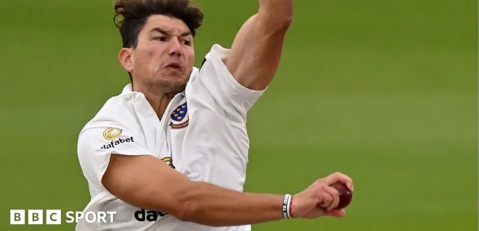 Cricketer delivering a ball during a match