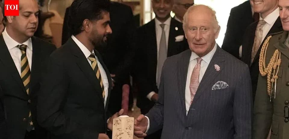 Babar Azam presenting a signed bat to King Charles
