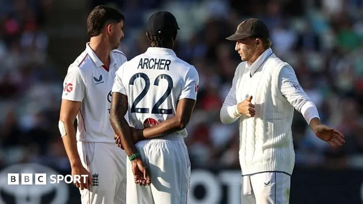 Three cricketers discussing strategy on the field