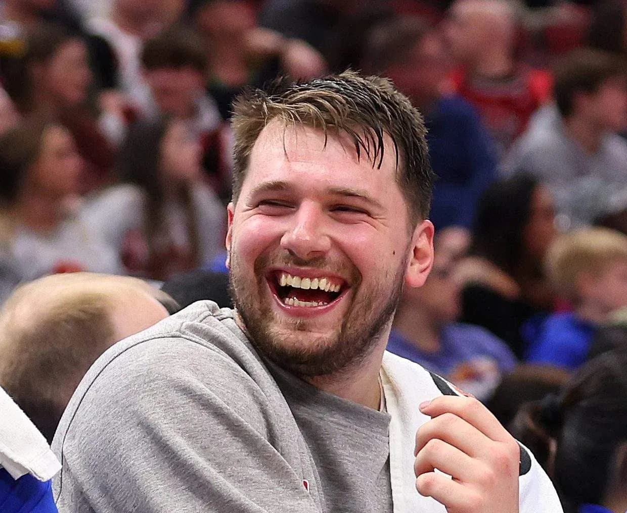 Player laughing on the bench during a game Player laughing on the bench during a game