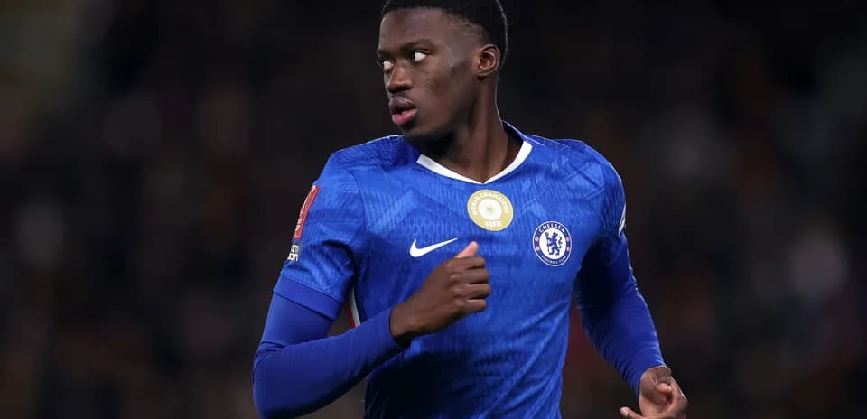 Chelsea player in blue jersey running on field