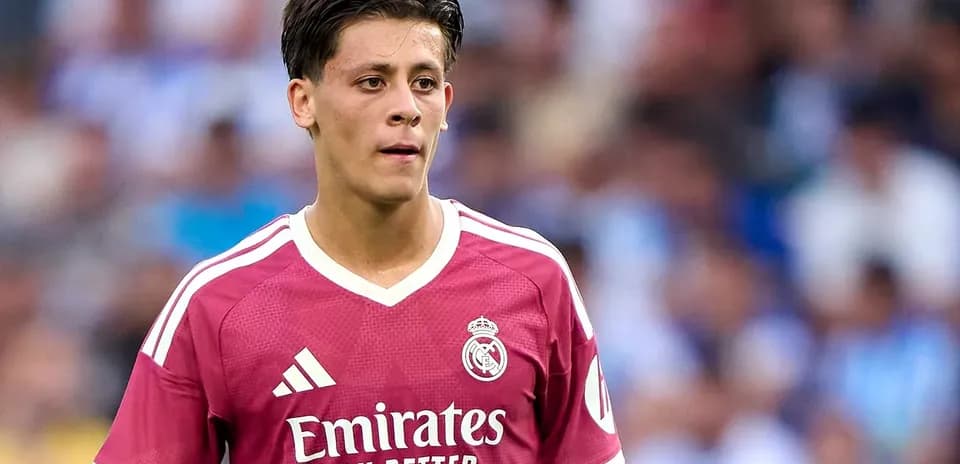 Player wearing pink Real Madrid jersey during match