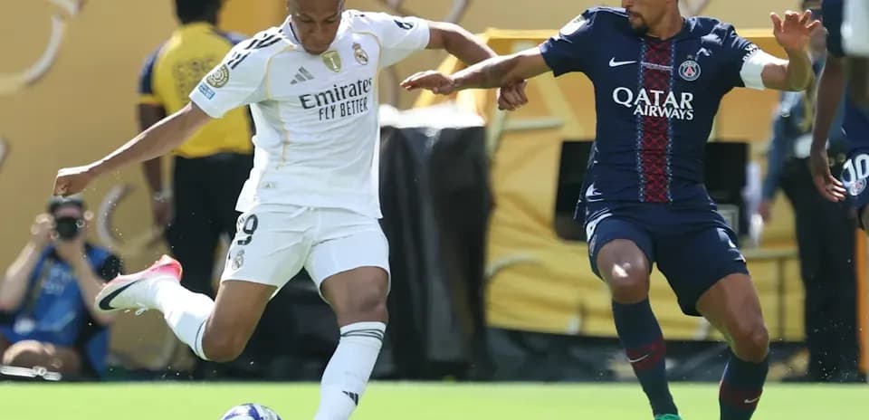 Player dribbling the ball during match between teams