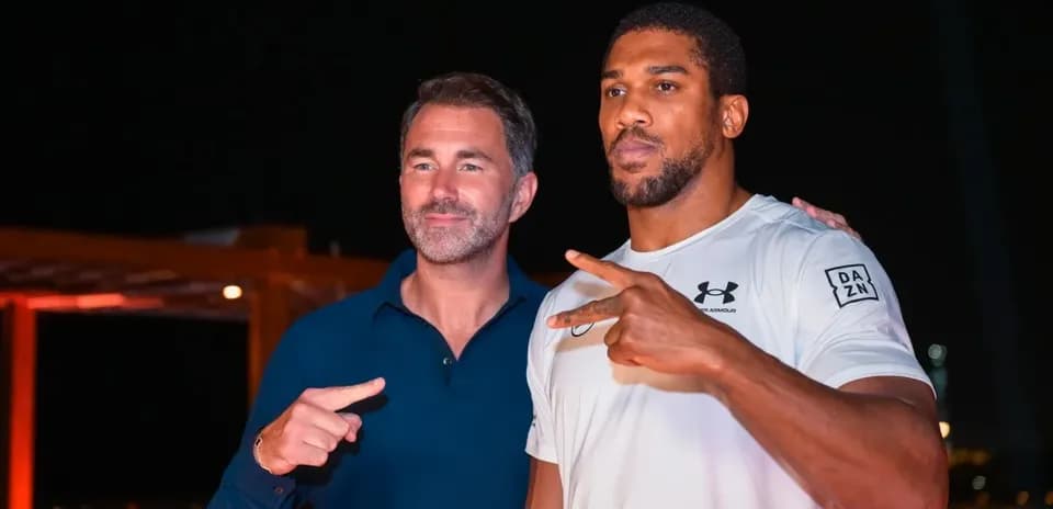 Two men posing together at event venue