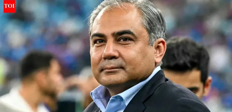 Man in a suit at a sporting event