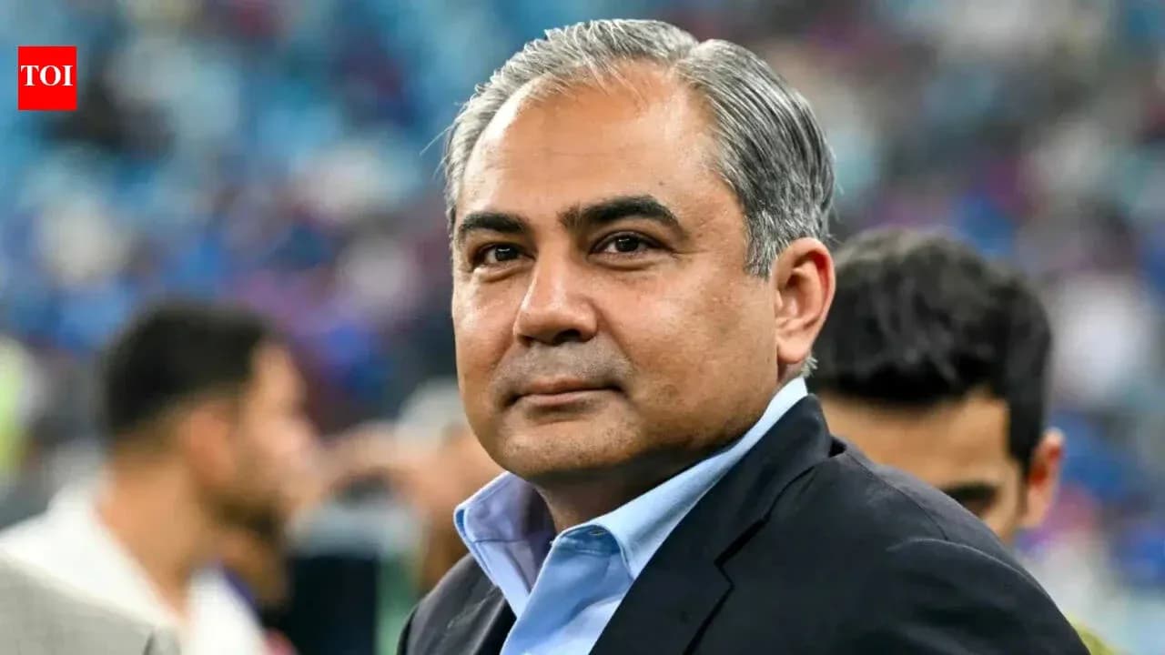 Man in a suit at a sporting event