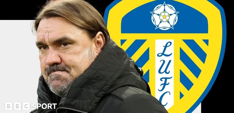 Manager with Leeds United logo in background