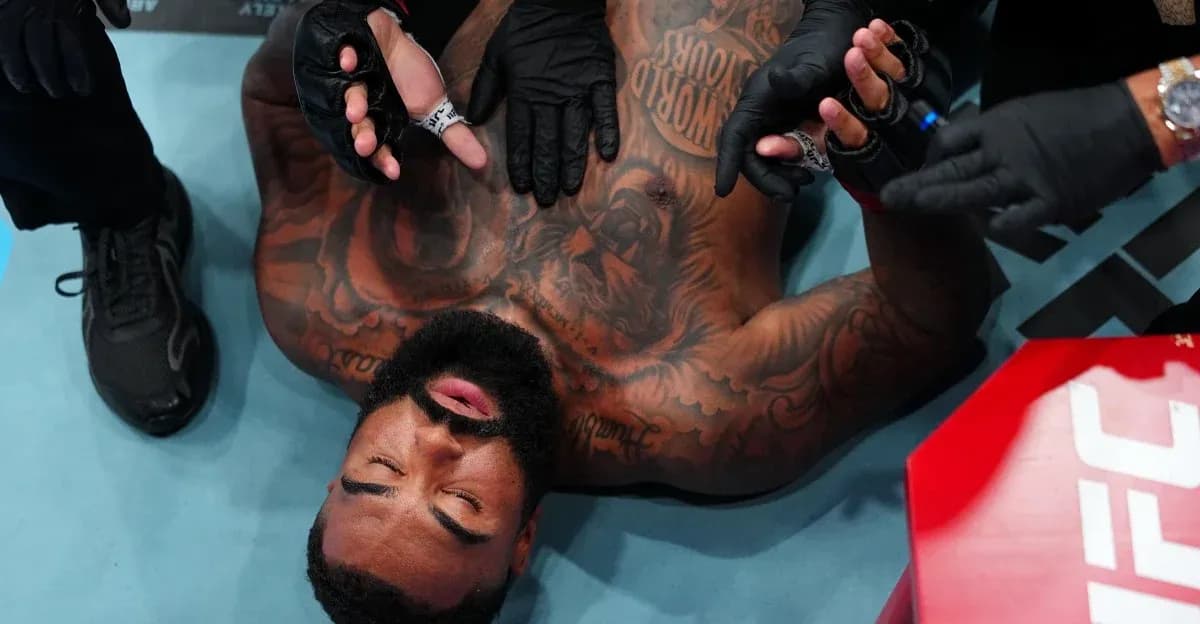 Fighter receiving medical attention in the octagon