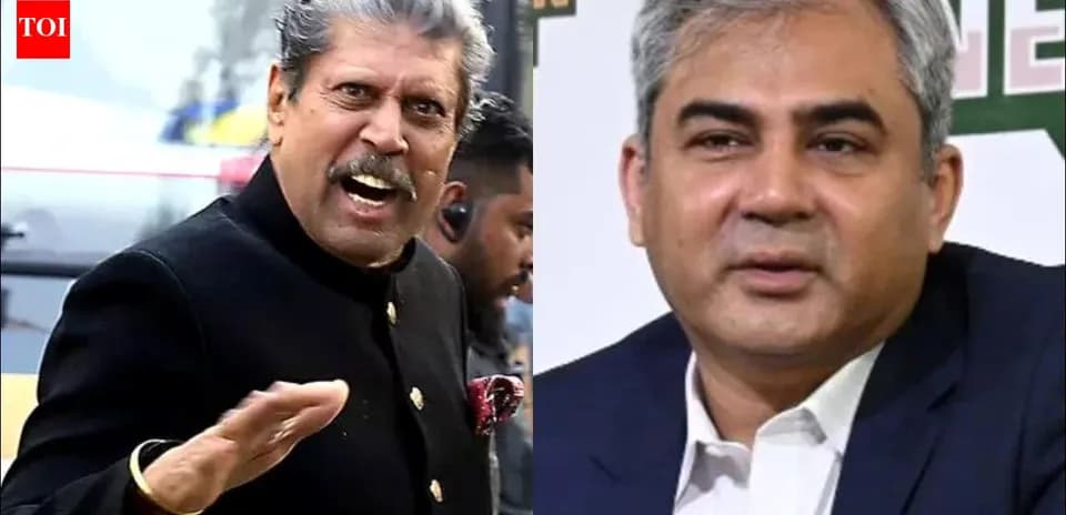 Two men speaking at an event with microphones