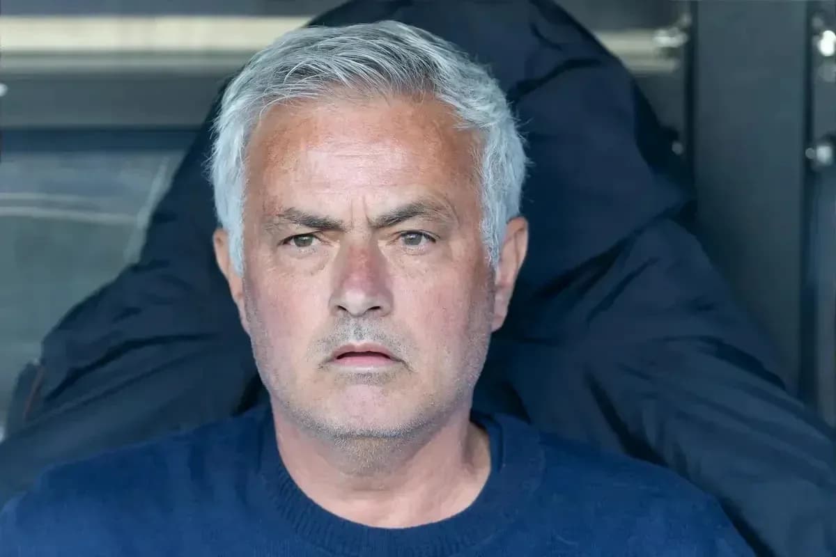 Coach sitting on bench during a match