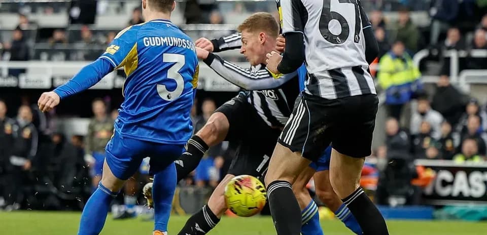 Leeds and Newcastle players competing for the ball