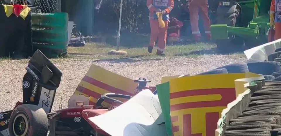 Car crash with debris and rescue personnel present