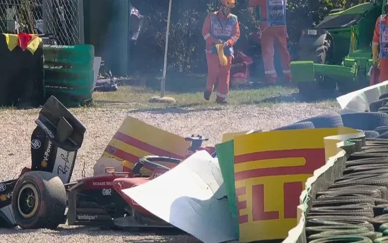Car crash with debris and rescue personnel present