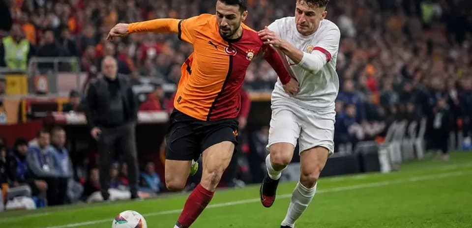 Player from Galatasaray being challenged by opponent