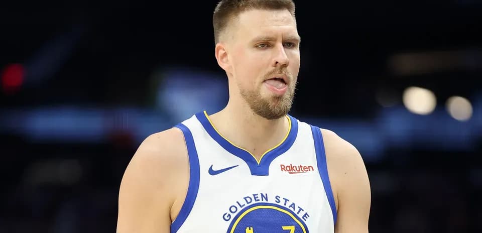 Player in Golden State Warriors jersey on court