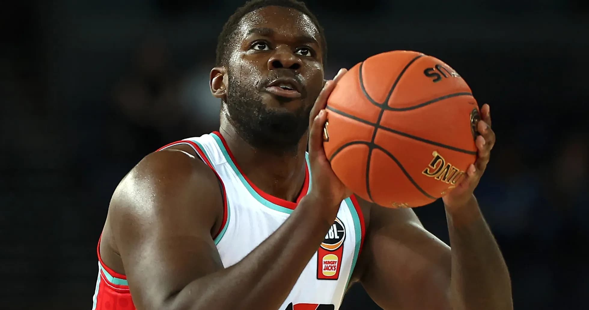 Player preparing to shoot basketball during game