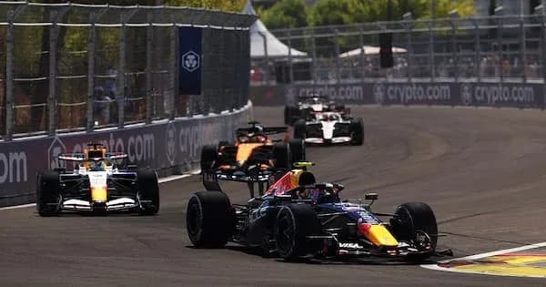 Cars racing on a street circuit during a race