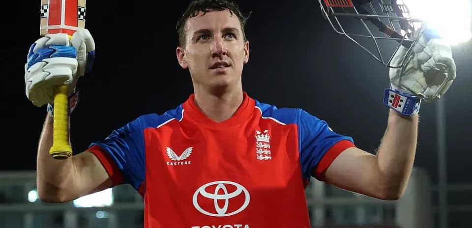 Cricketer celebrating with bat after scoring runs