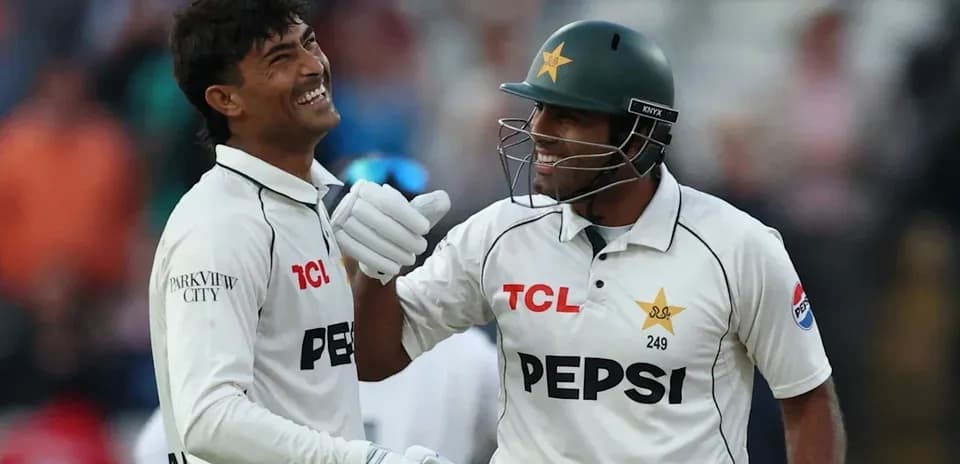Two Pakistani cricketers celebrating during a match