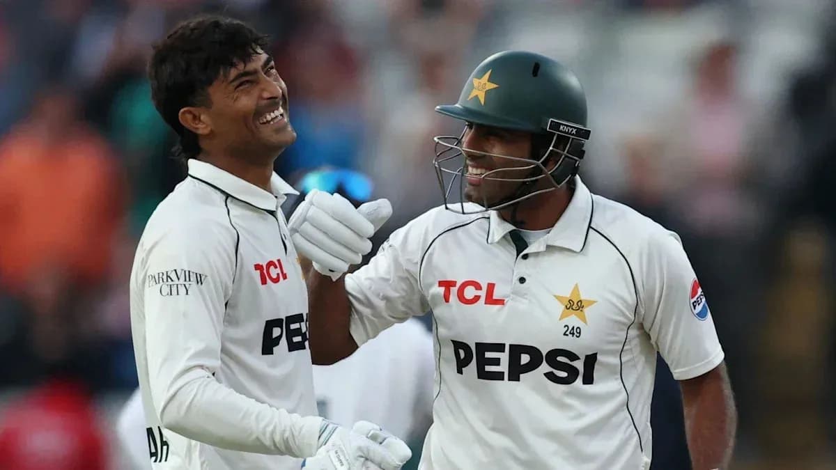 Two Pakistani cricketers celebrating during a match
