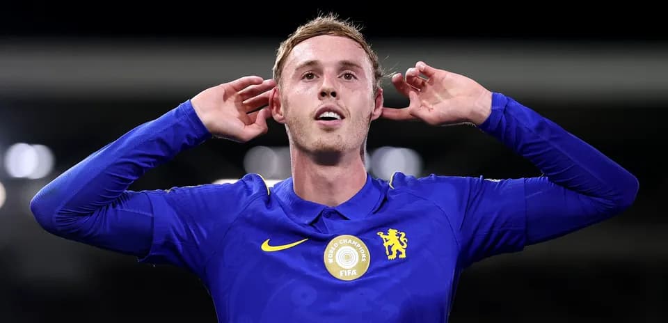 Player celebrating a goal with hands to ears