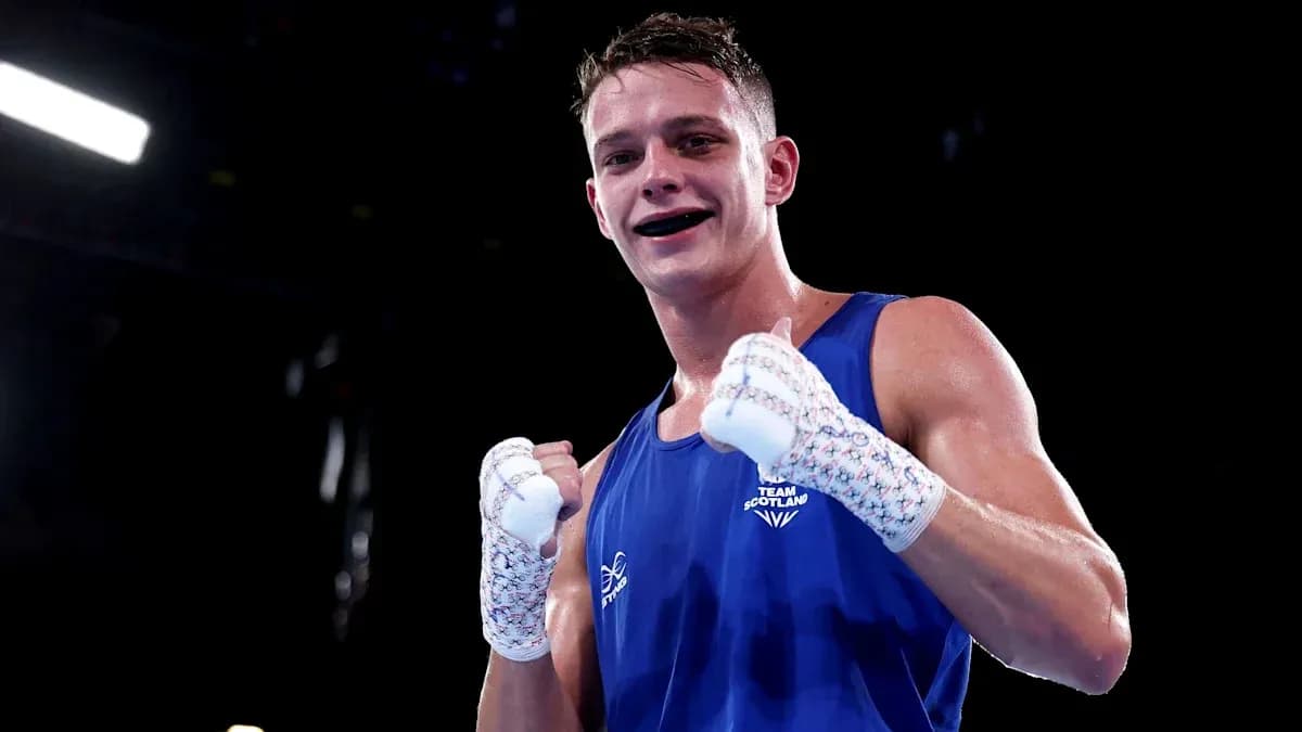 Boxer in blue celebrating victory after match