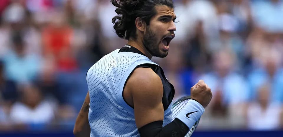 Tennis player celebrating a point during match