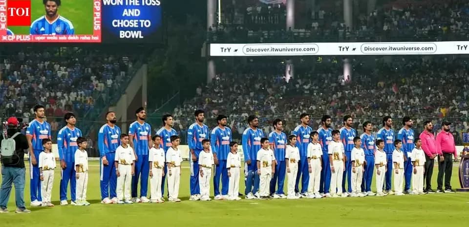 Cricket team and children lined up before match