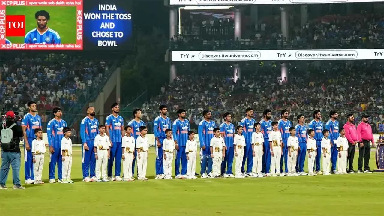 Cricket team and children lined up before match