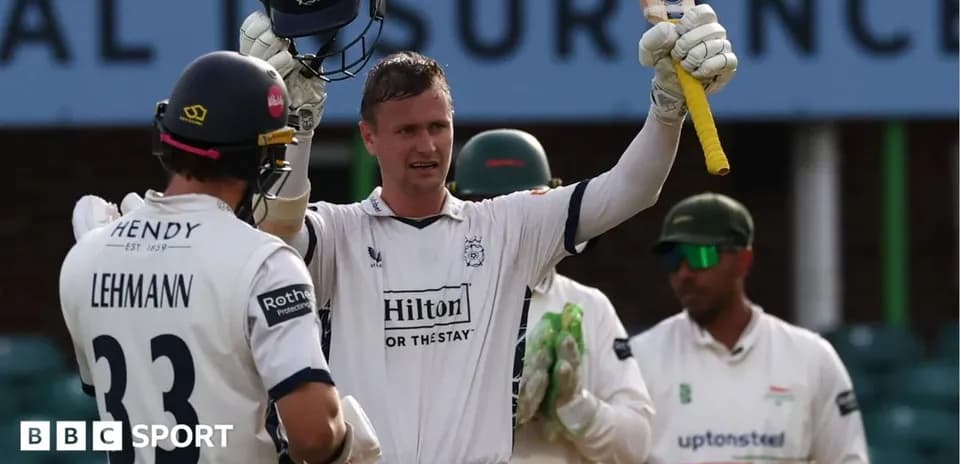 Batsman celebrating after scoring a milestone in cricket match