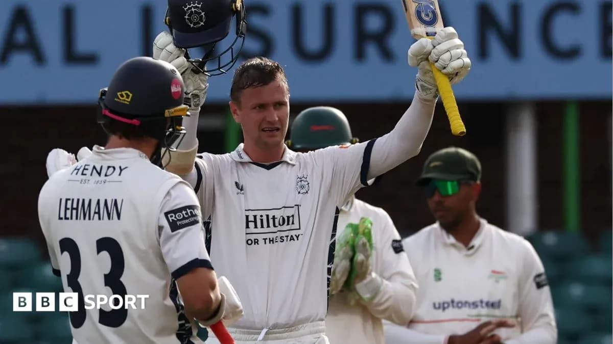 Batsman celebrating after scoring a milestone in cricket match