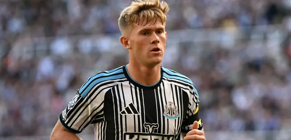Newcastle player in black and white striped jersey