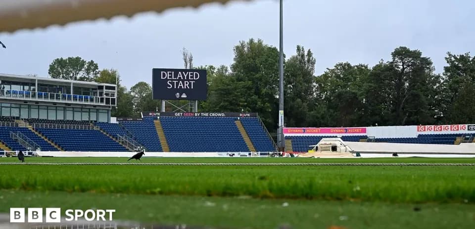 Cricket ground with delayed start sign displayed