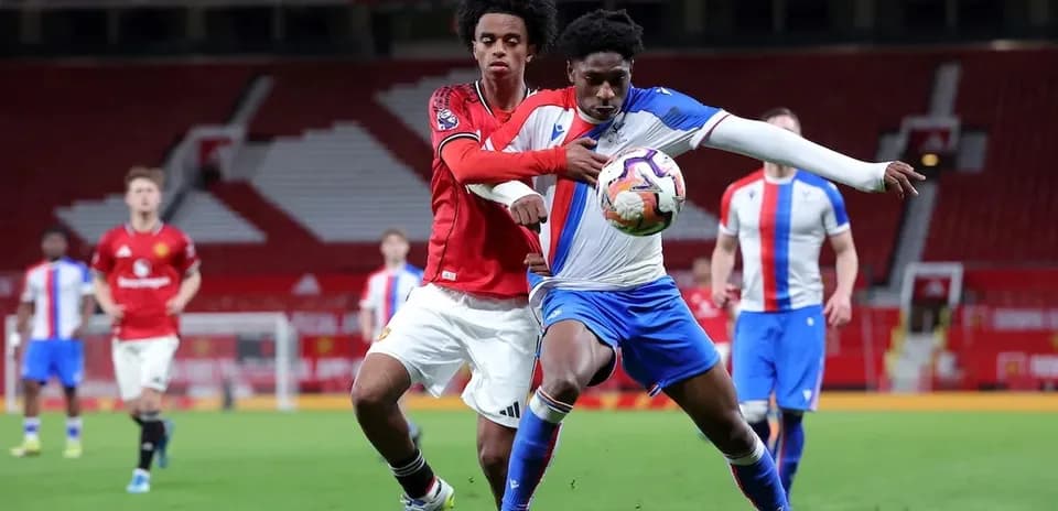 Players contesting possession during a football match