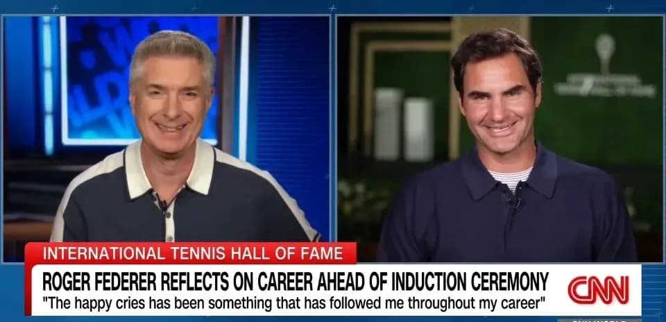 Two hosts discussing Roger Federer on CNN