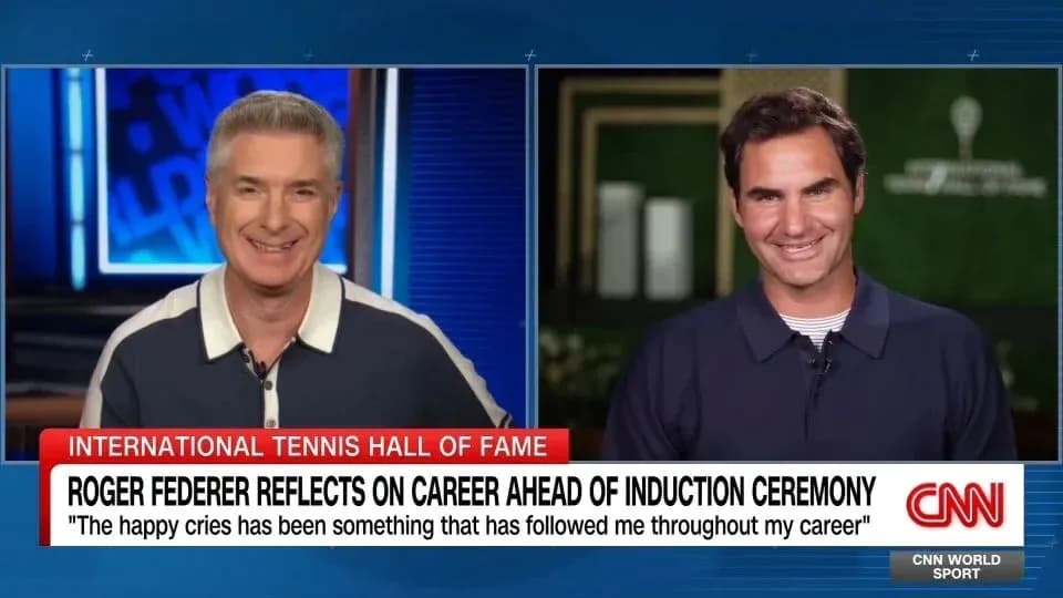 Two hosts discussing Roger Federer on CNN