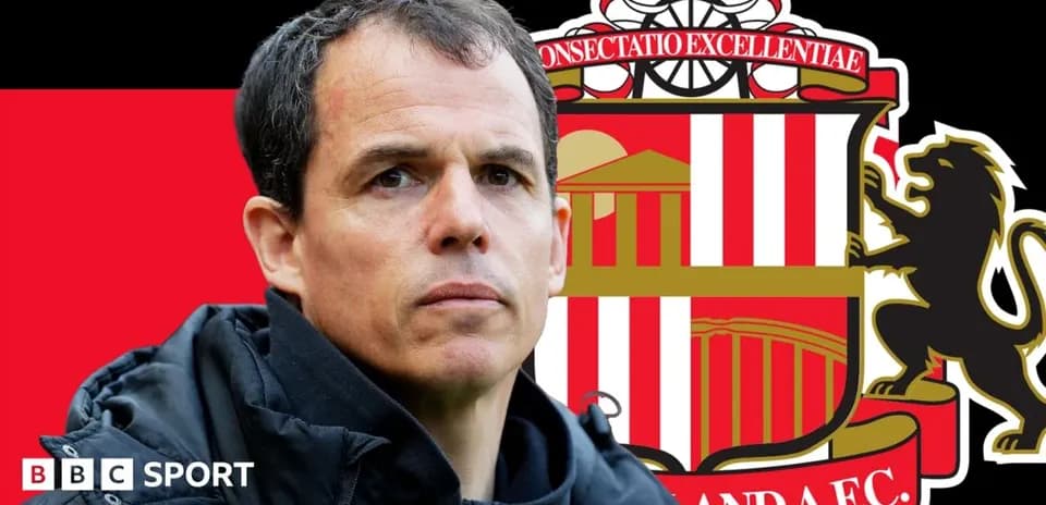 Coach in front of Sunderland A.F.C. logo background