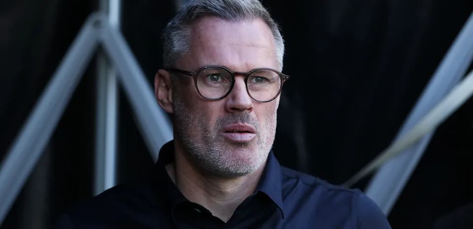Man with glasses looking intently during event