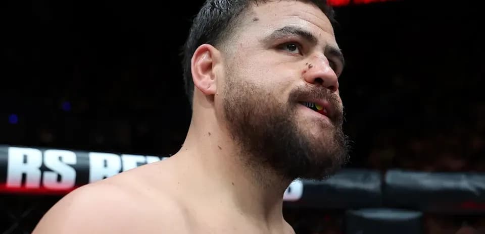 Fighter with mouthguard in the octagon